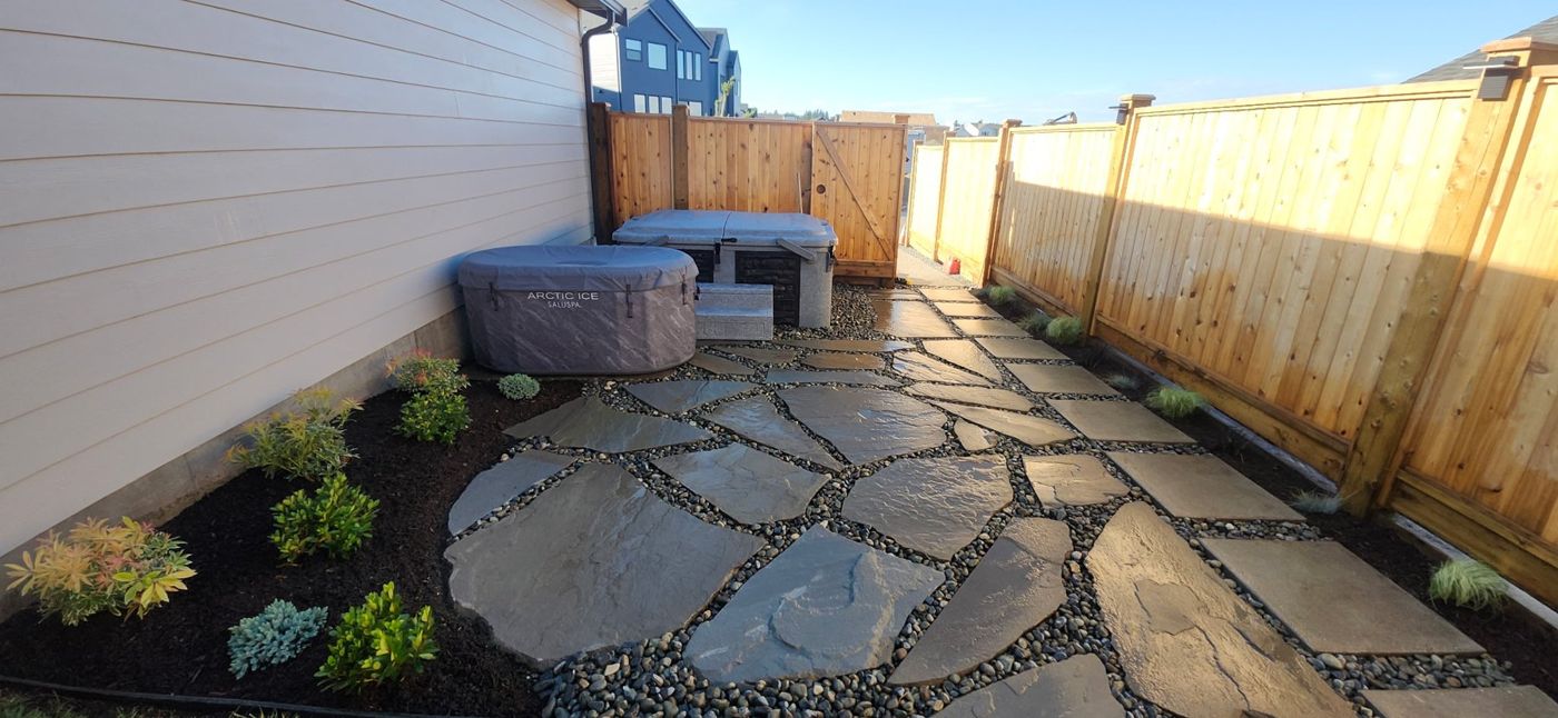 Stone patio and landscaped courtyard - O’Callaghan Landscaping Ltd.