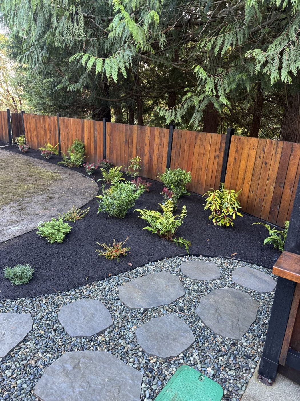 Stone path and garden beds - O’Callaghan Landscaping Ltd.