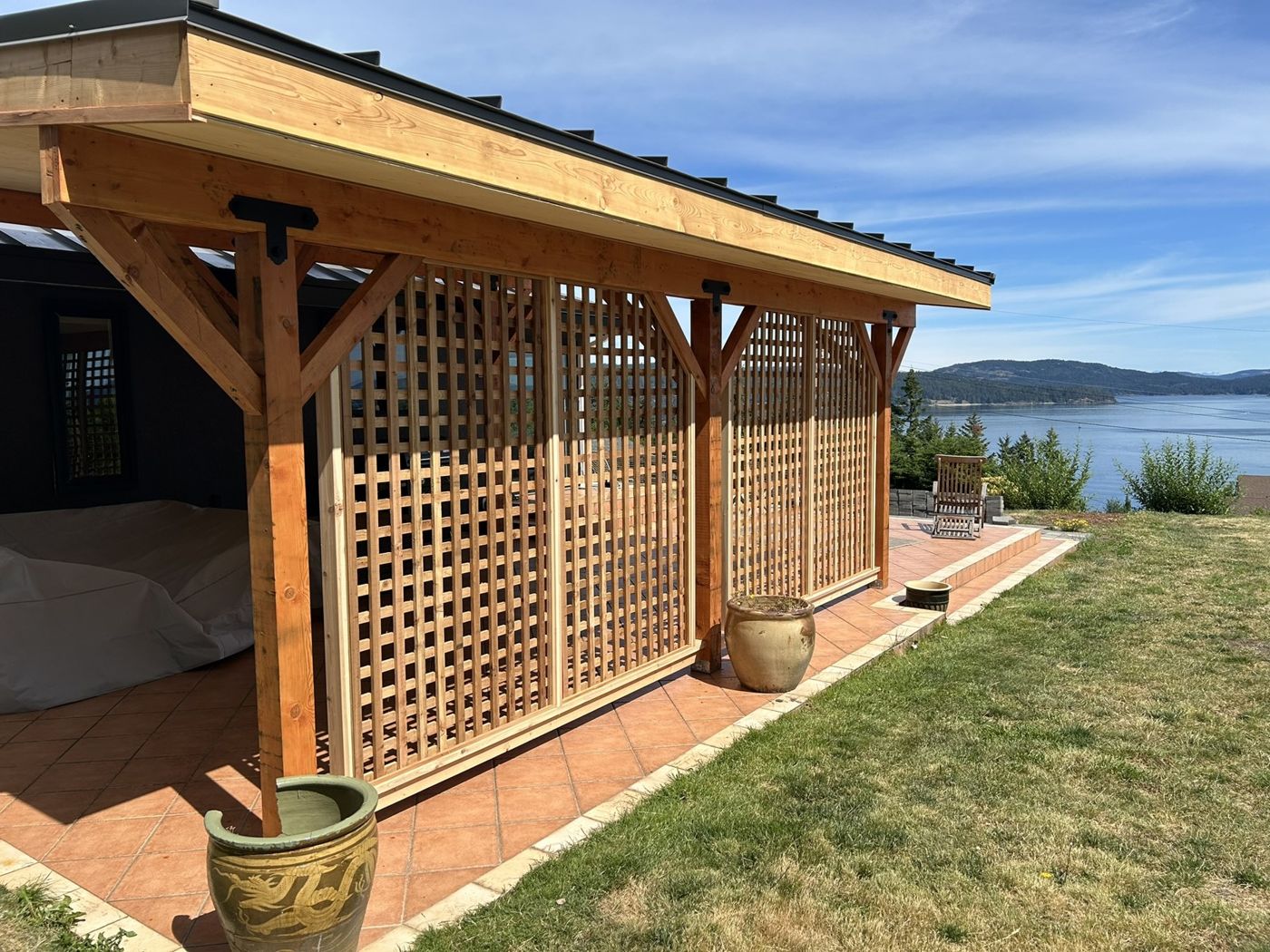 Finished timber outdoor living pavilion overlooking the water